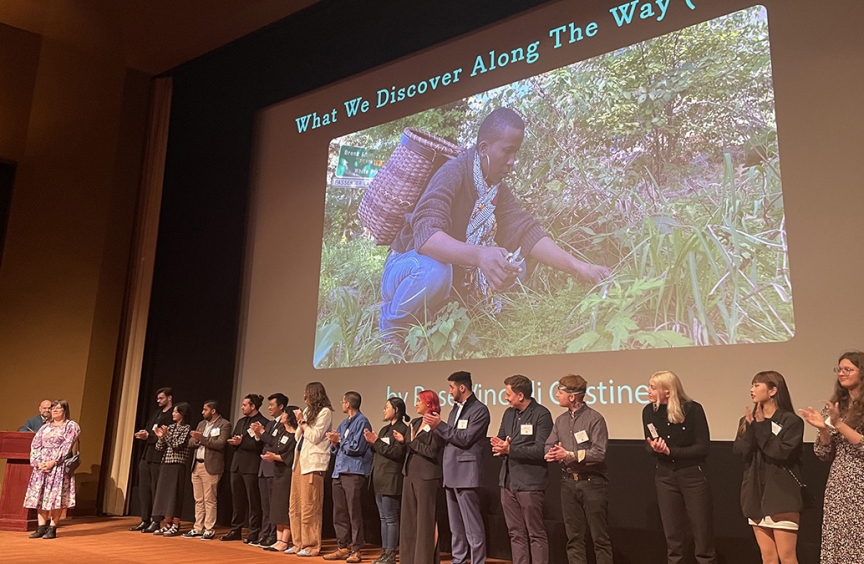 A long line of SVA filmmakers stand on stage to celebrate the SVA Premieres screening event