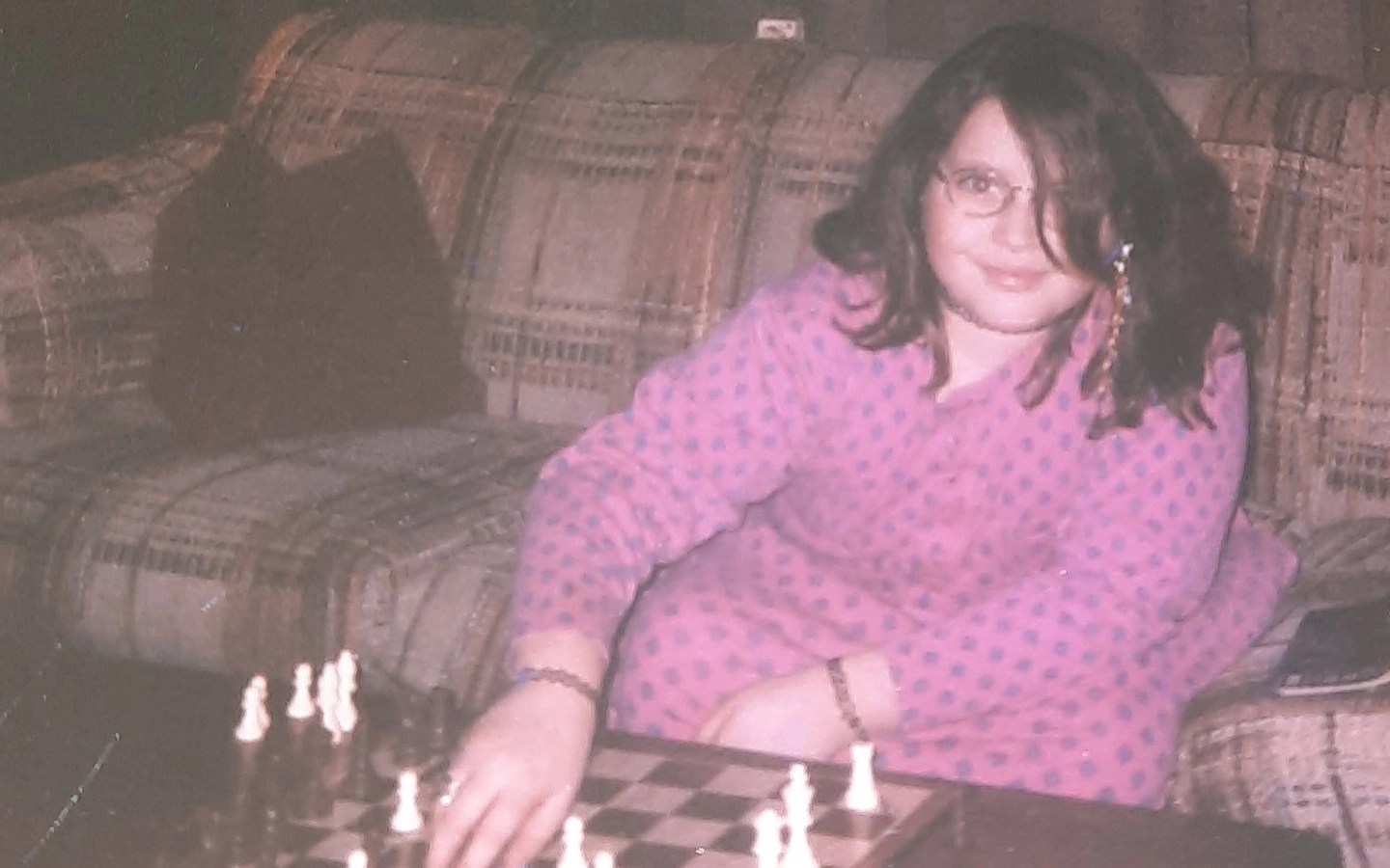 Vintage childhood photo of the artist as a young girl playing chess.